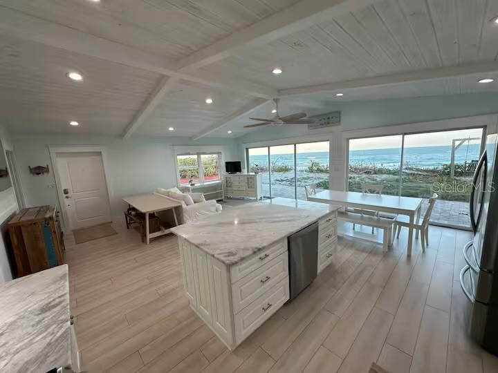 Huge sliding doors that open wide to the ocean.
