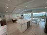 Huge sliding doors that open wide to the ocean.