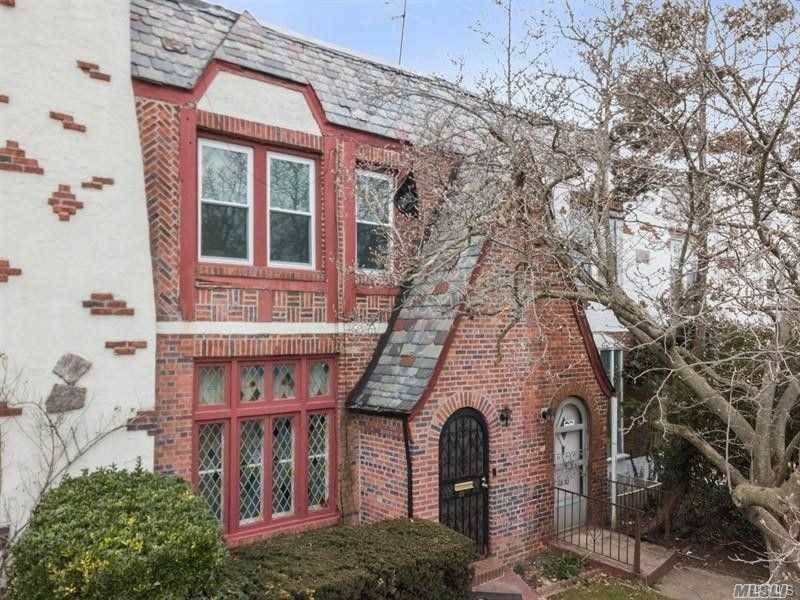 Stately 3 Bedroom, 1. 5 Bath Brick Tudor features Sunken Living Room with Stained Glass Windows, Formal Dining Room which overlooks Backyard, Eat in Kitchen with entry to Backyard.