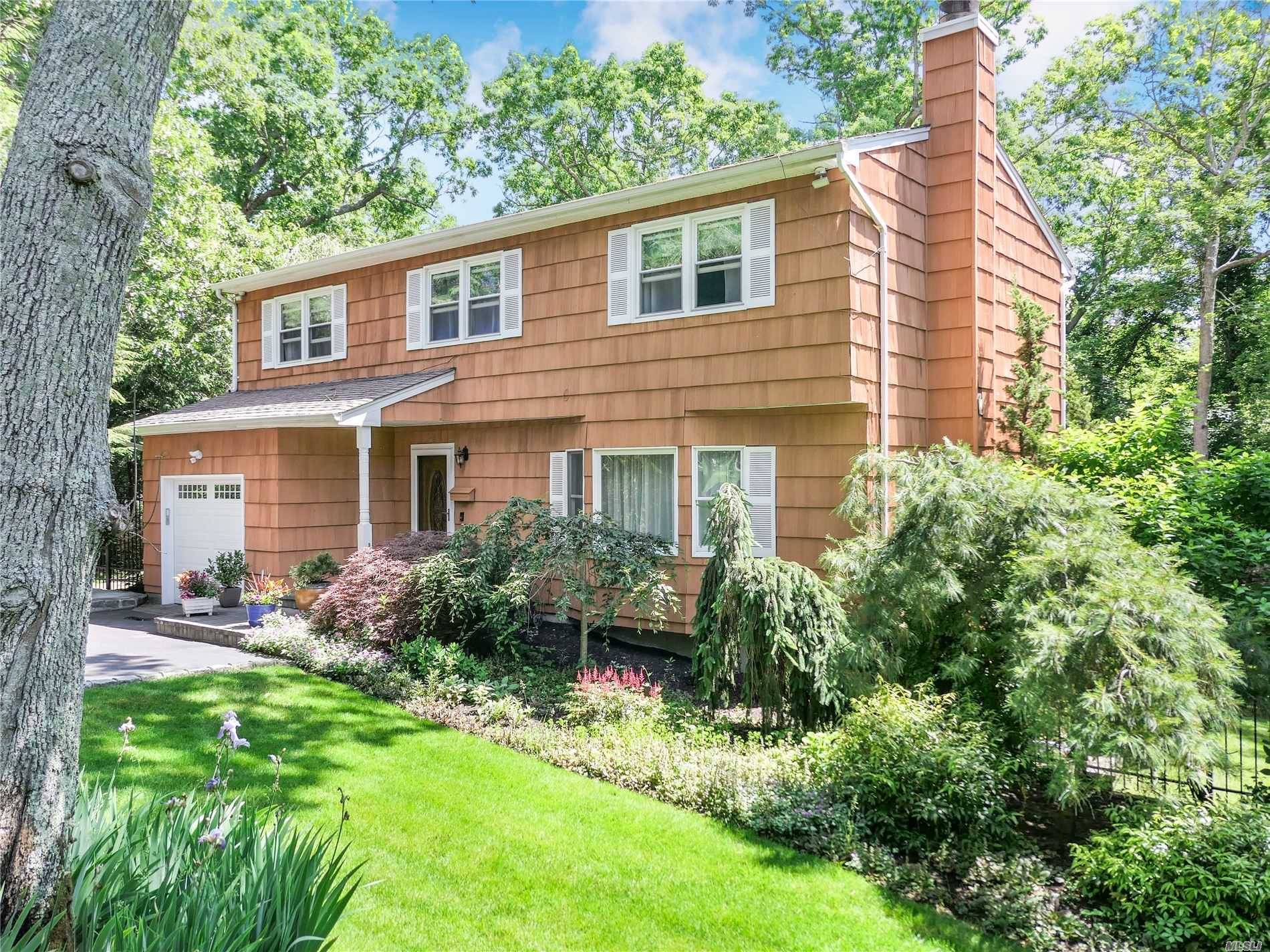 Nestled On Meticulously Kept Landscaping In The Heart Of Bellport Village This Beautiful Colonial Is Pure Serenity.