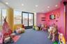 Recreation room with recessed lighting and carpet floors