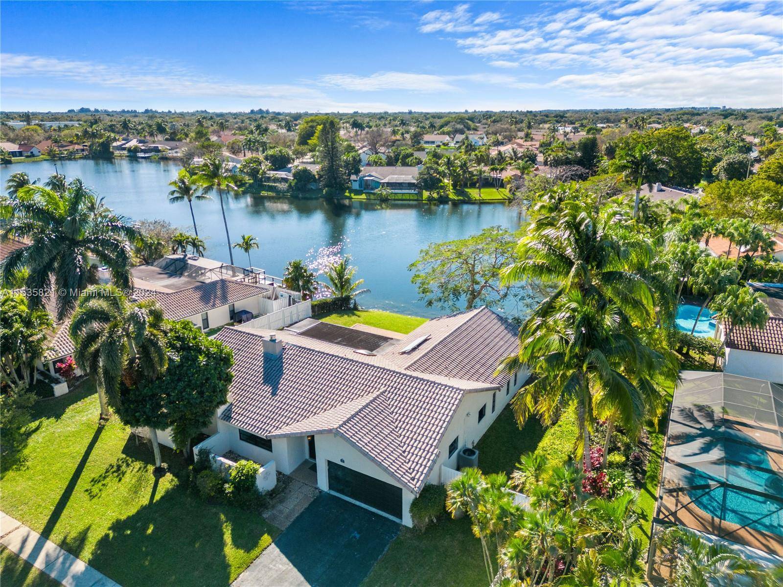 Welcome to this remarkable fully remodeled 4 bed, 3 bath home featuring a picturesque lake view in desirable Plantation, FL !