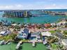 Drone shot looking down at 4 Bellevue and south to The Devil's Elbow and beyond the bridge leading to the beaches and the Gulf of Mexico.