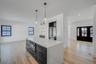 Thoughtfully designed kitchen featuring clean finishes, modern cabinetry, and an open layout that connects seamlessly to the dining area and main livi