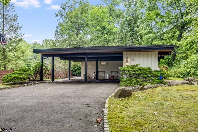 This charming mid century modern ranch style home blends comfort, functionality, and flexibility.