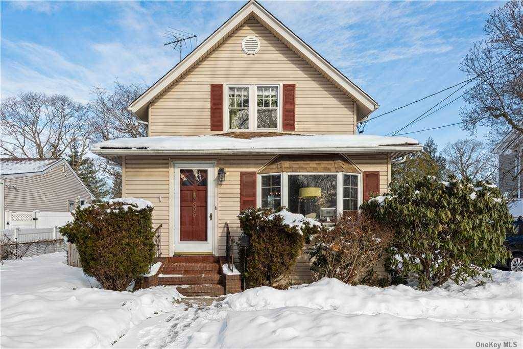 This traditional colonial offers wood floors, a beautiful renovated kitchen, and all bedrooms upstairs.