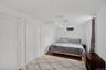 Bedroom with wood finished floors