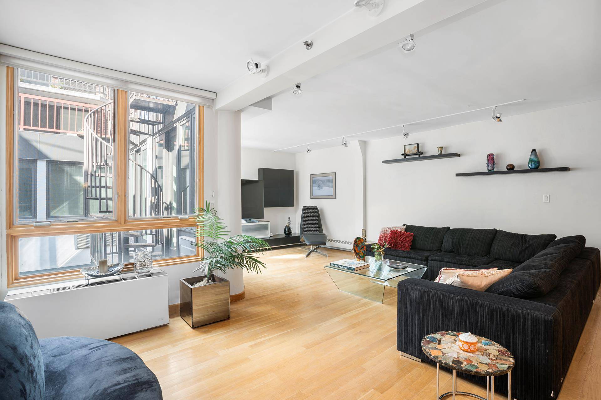 BRING OFFERS ! This fabulous duplex condo home spans over 2, 000 square feet on one of the most desirable, tree lined, historic streets in the West Village.