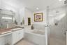 Renovated master bath with 2 sinks, shower and bathtub