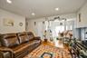 Living area with wood finished floors and recessed lighting