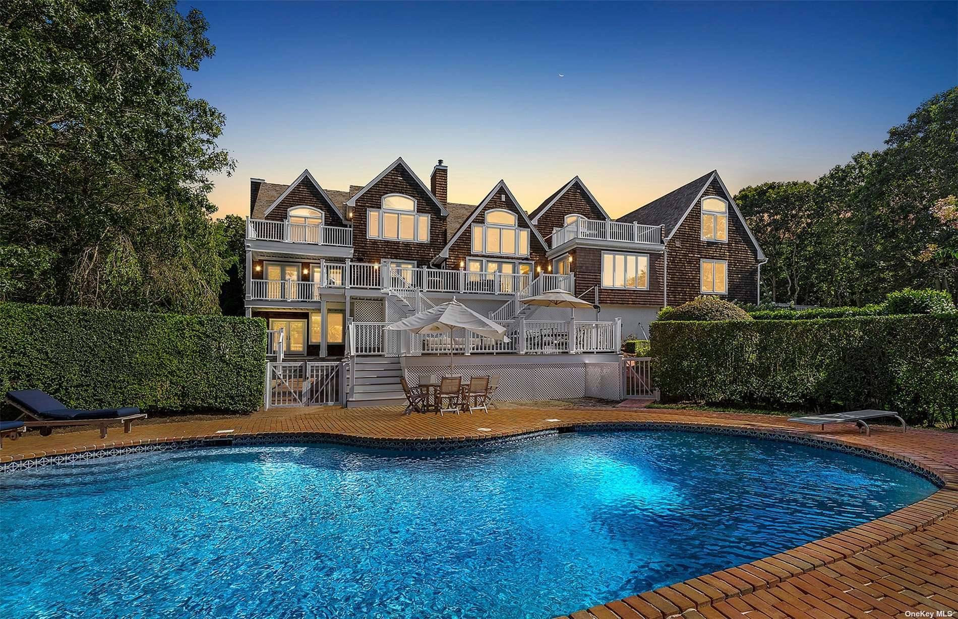 Welcome home to this gated estate with jaw dropping hilltop and water views sited on just over 3 acres in the prestigious Fourteen Hills neighborhood of Sag Harbor.