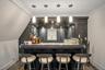Den Bar with sink, hardwood / wood-style floors, pendant lighting, and ornamental molding