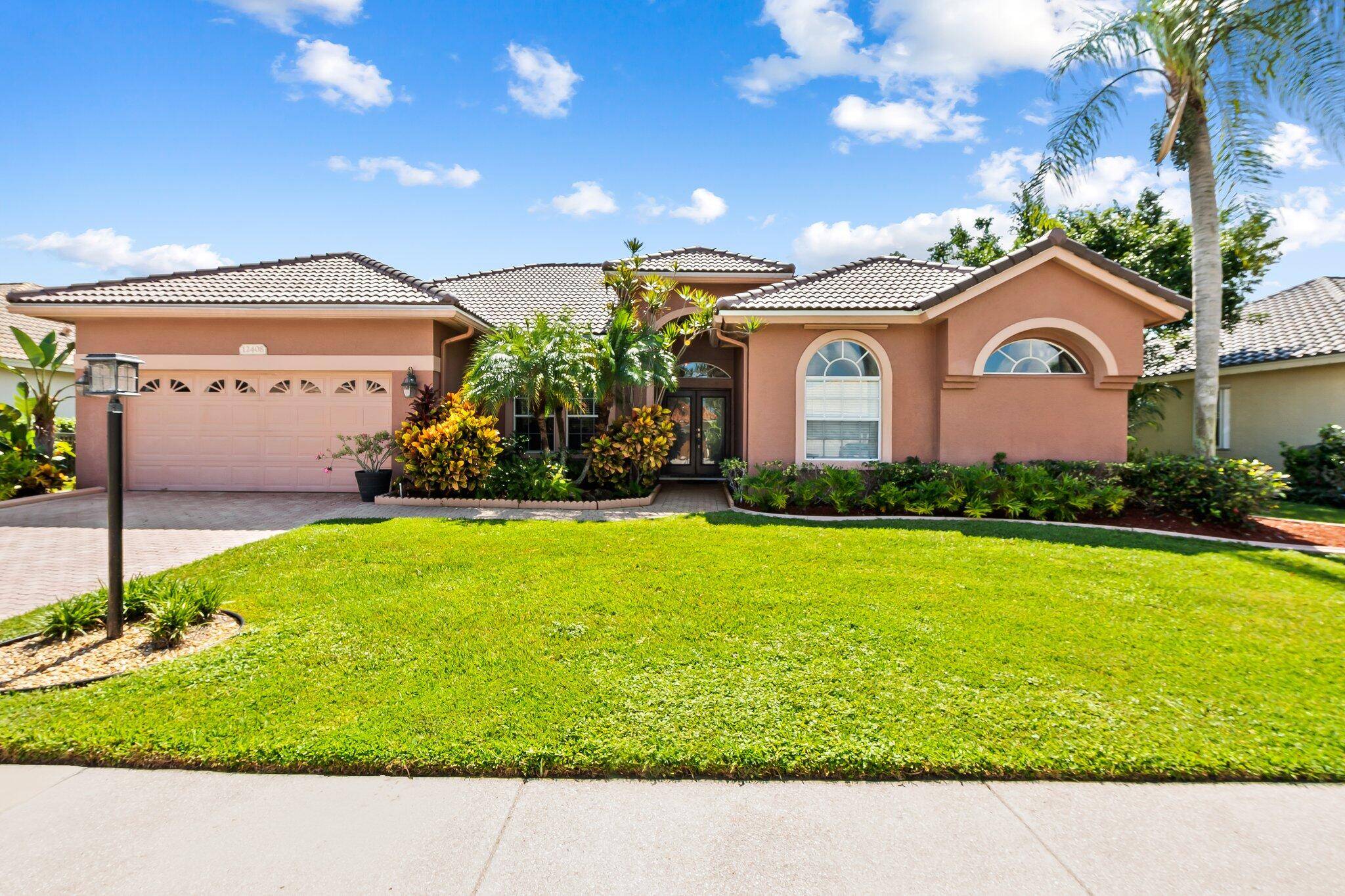 Don't miss this great family home with desirable split floor plan in the gated community of Boca Falls.
