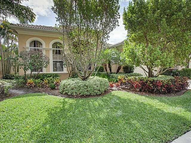 Well maintained Mirasol Country Club home with large patio and expansive lake view.