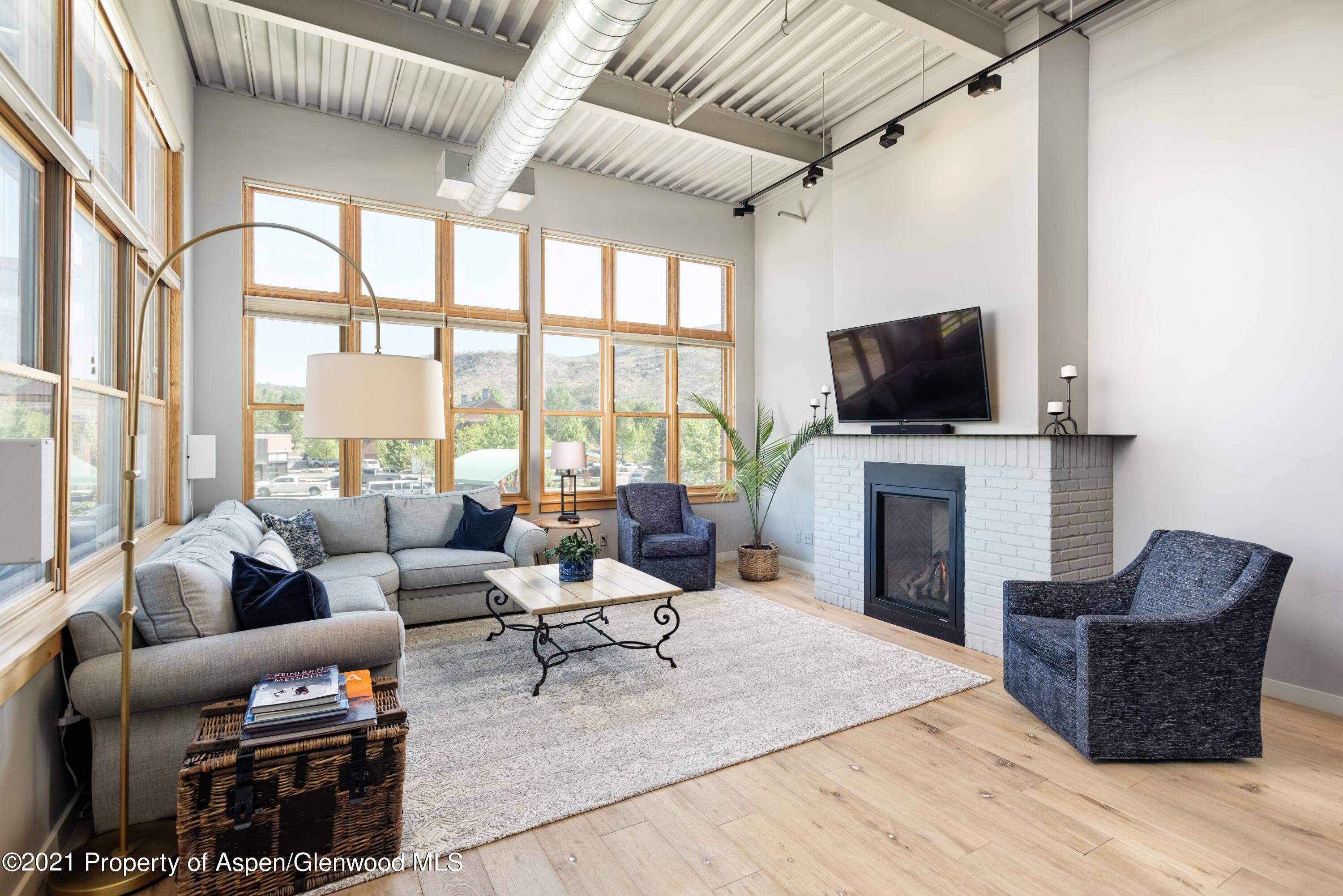 This contemporary over sized corner unit is located in the sought after Triangle Park Loft building.