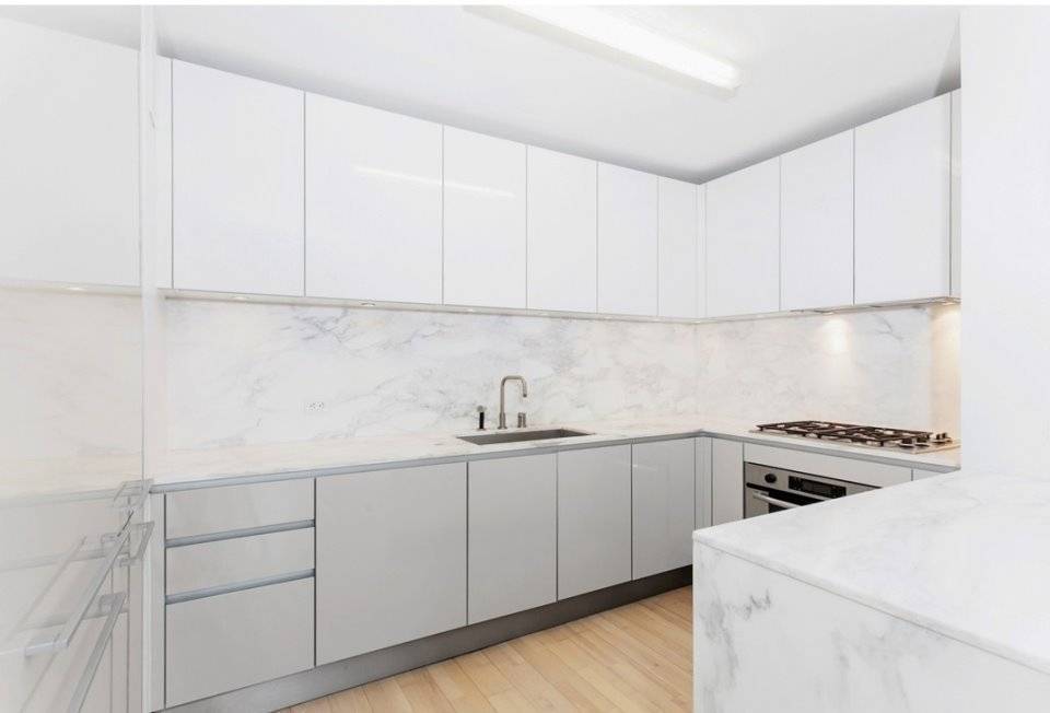 Generous 2 bedroom, 2 bathroom layout with Nordic Ash plank hardwood floors, chef quality kitchen, custom Italian doors, in unit washer dryer, central park views and generous closet space.