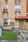 Back of property featuring brick siding