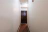 Corridor featuring dark tile patterned flooring