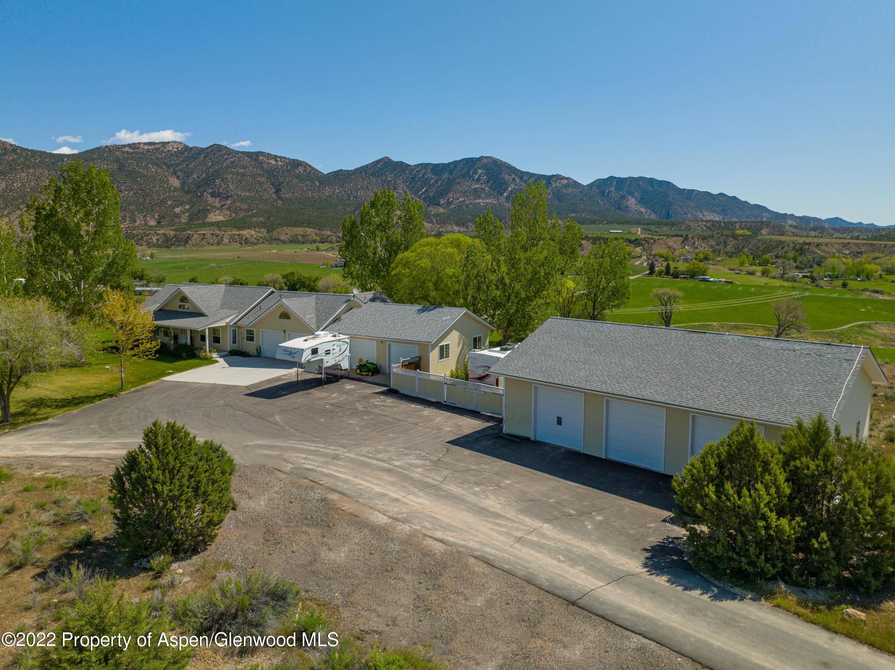 7 7 I'm in Heaven ! ! ! Almost 7 acres, 7 garages, views that will stop you in your tracks.