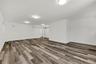 Empty room with wood finished floors and baseboards