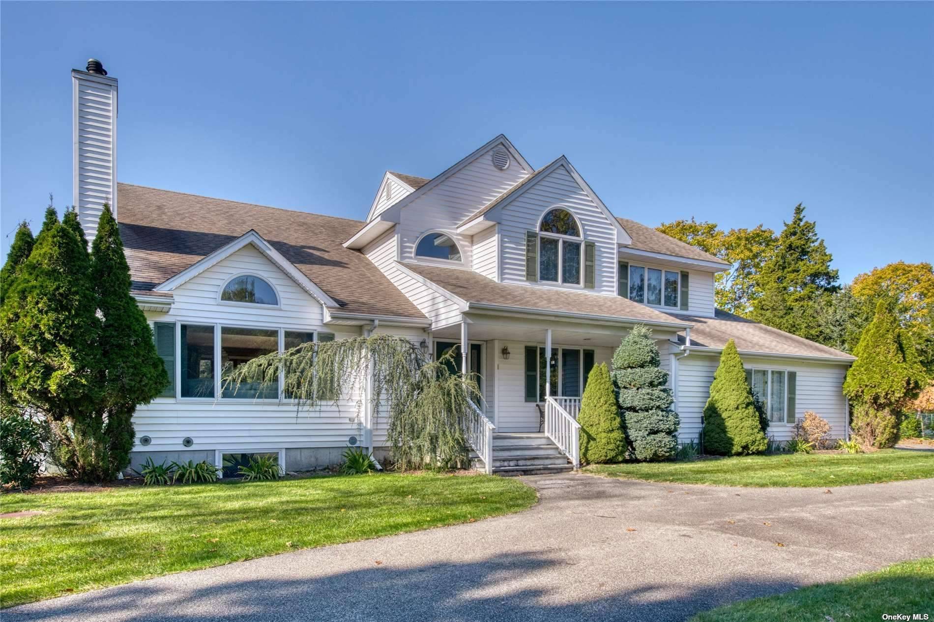 Enjoy your summer in Westhampton in this spacious 5 bedroom, 3 1 2 bath home perfect for entertaining, both indoors or out.
