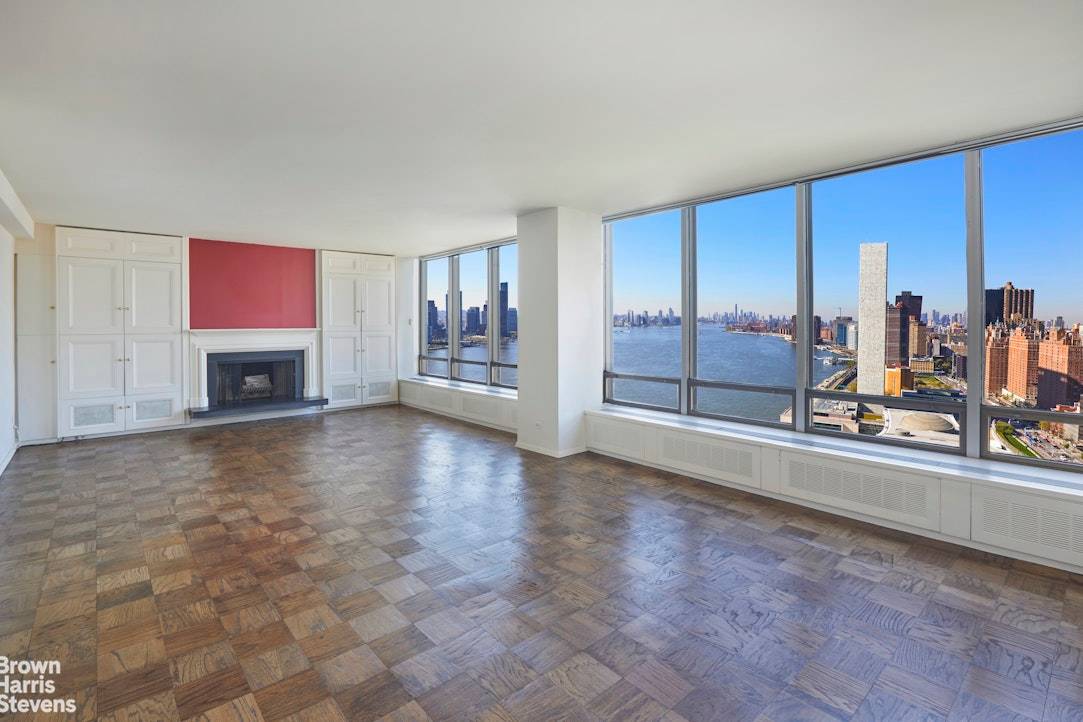Mid Century Modern Time Capsule With Awe Inspiring Views From Every RoomExpansive views of the East River, United Nations, and both Manhattan and Brooklyn skylines welcome you to this very ...
