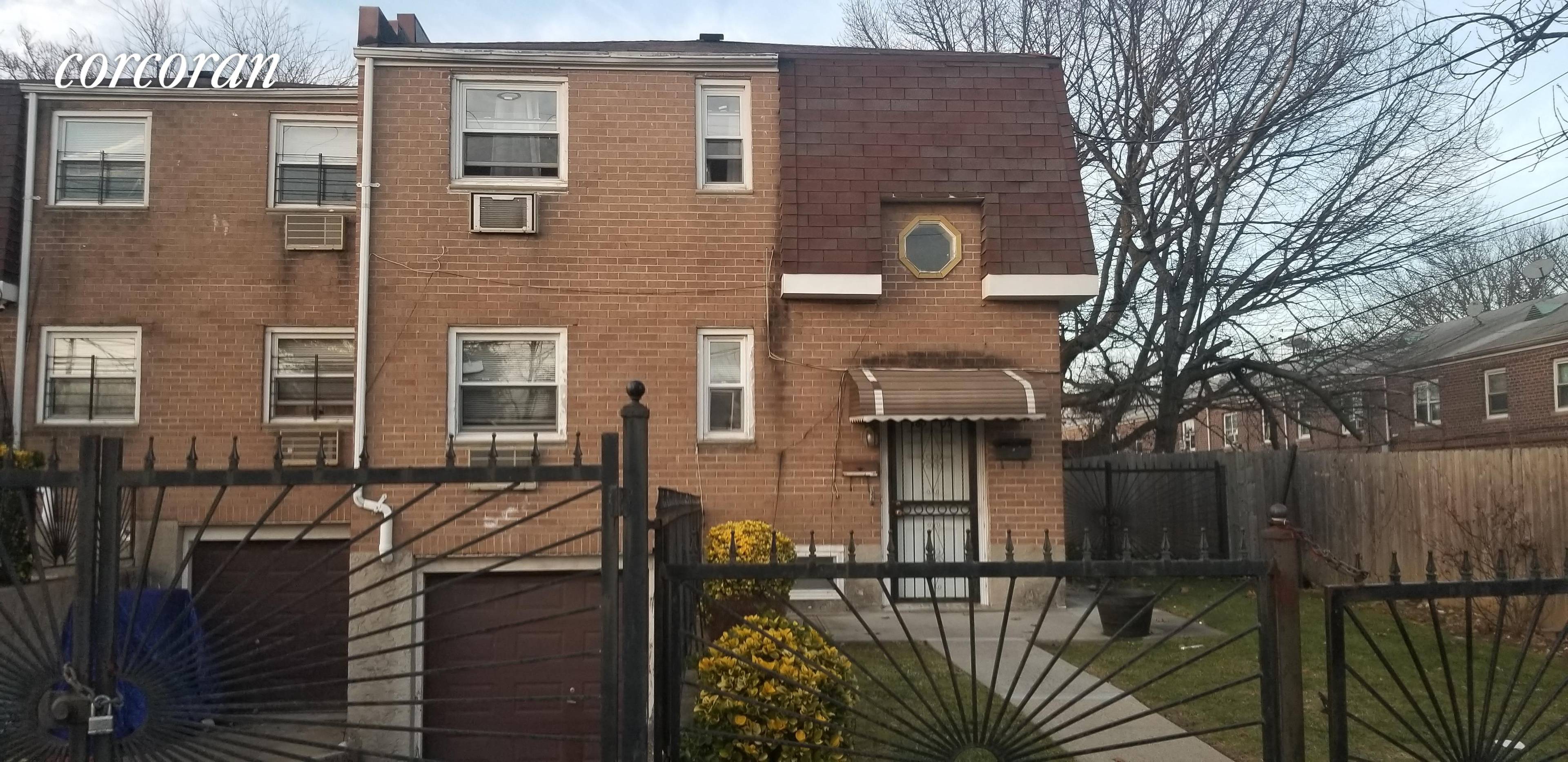 A large Multi unit home in St Albans, Queens NY, with 6 bedrooms, 5 baths, 2 kitchens, wood floors, high ceilings, finished Basement, driveway, backyard, on a tree lined block.