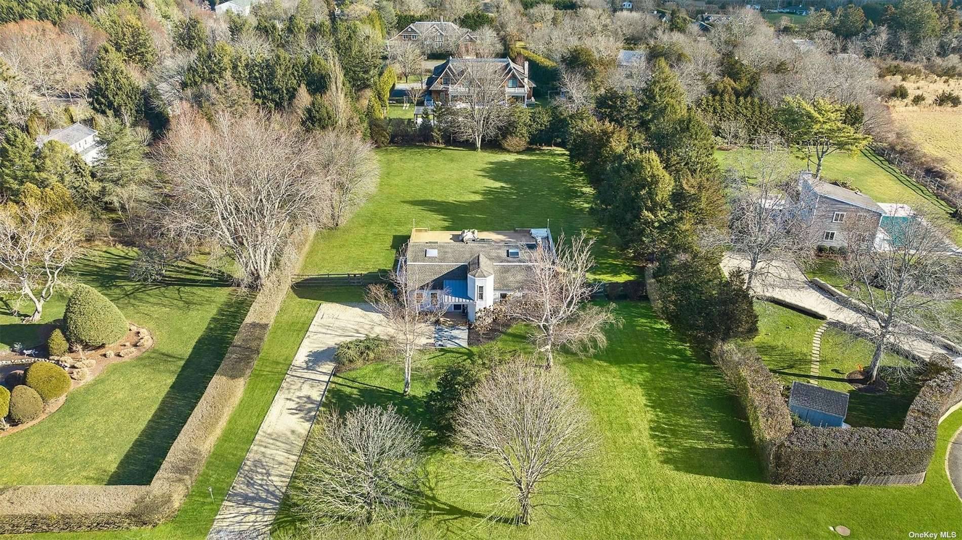 Nestled on a quiet cul de sac in Bridgehampton, this park like, Gambrel styled property features 2, 200 sf of living space, 3 bedrooms, 2 baths, double height ceilings, and ...