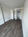 Unfurnished bedroom featuring dark wood finished floors and a closet