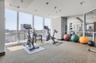 Gym with floor to ceiling windows