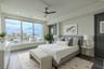 2nd Bedroom: This light-filled bedroom offers sweeping views through a wall of floor-to-ceiling windows that capture both the cityscape and the Intrac