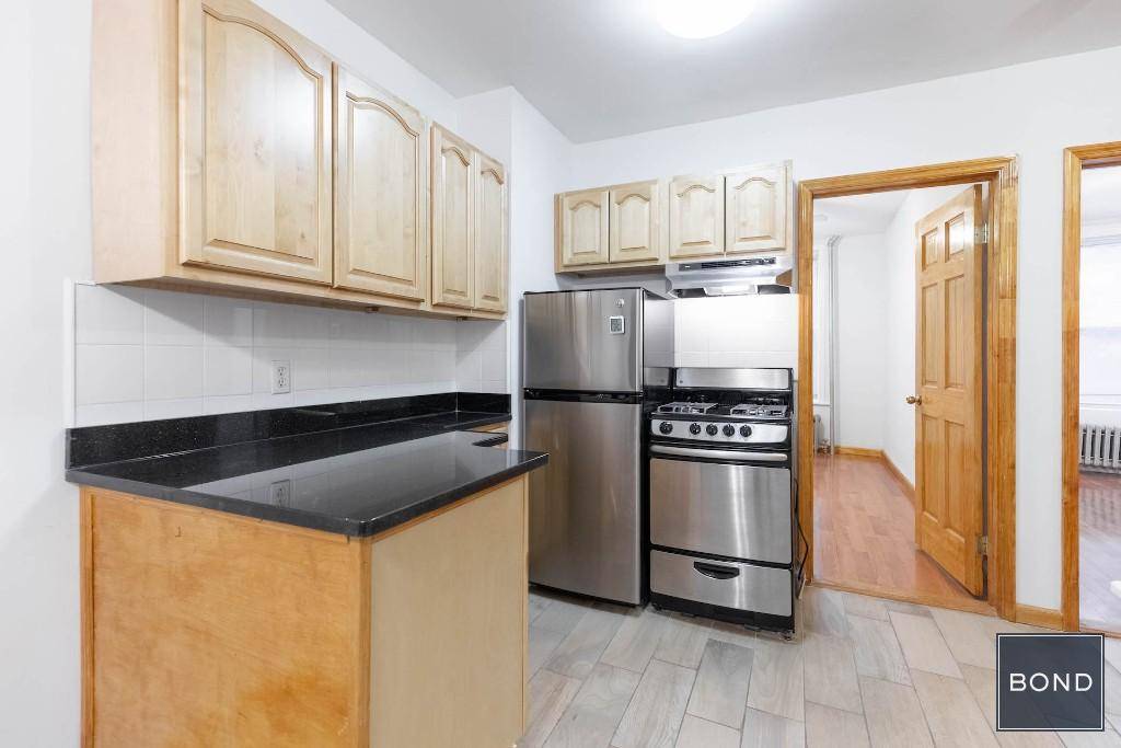 Nicely updated three bedroom apartment with granite and stainless steel kitchen !