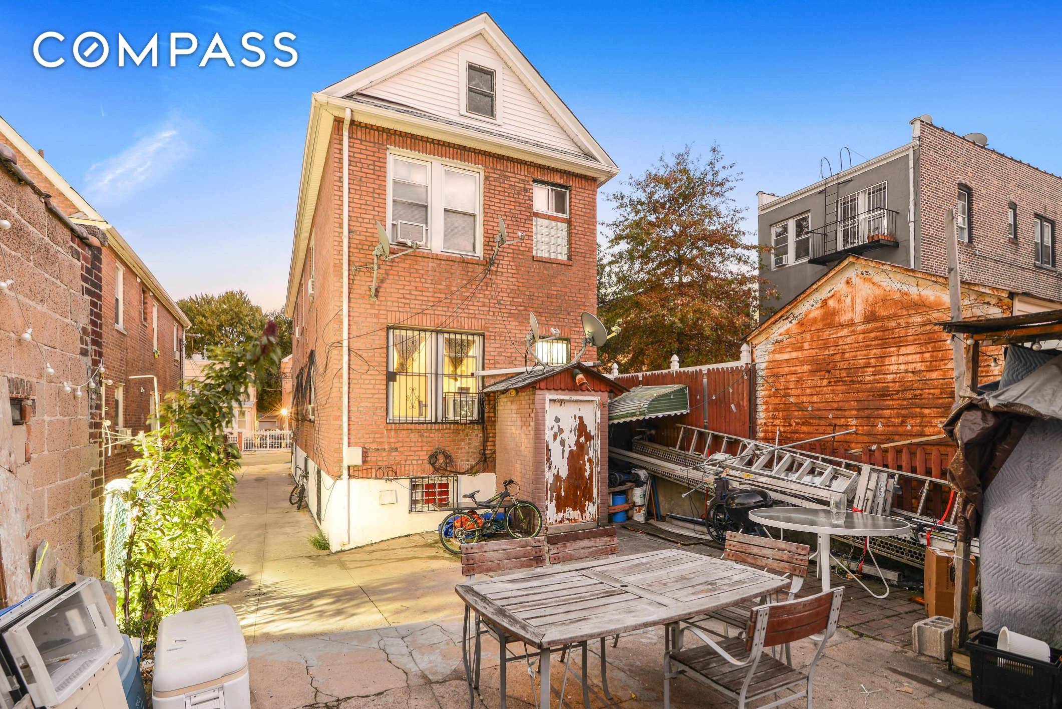 2 Family detached Brick home in the heart of Woodside.