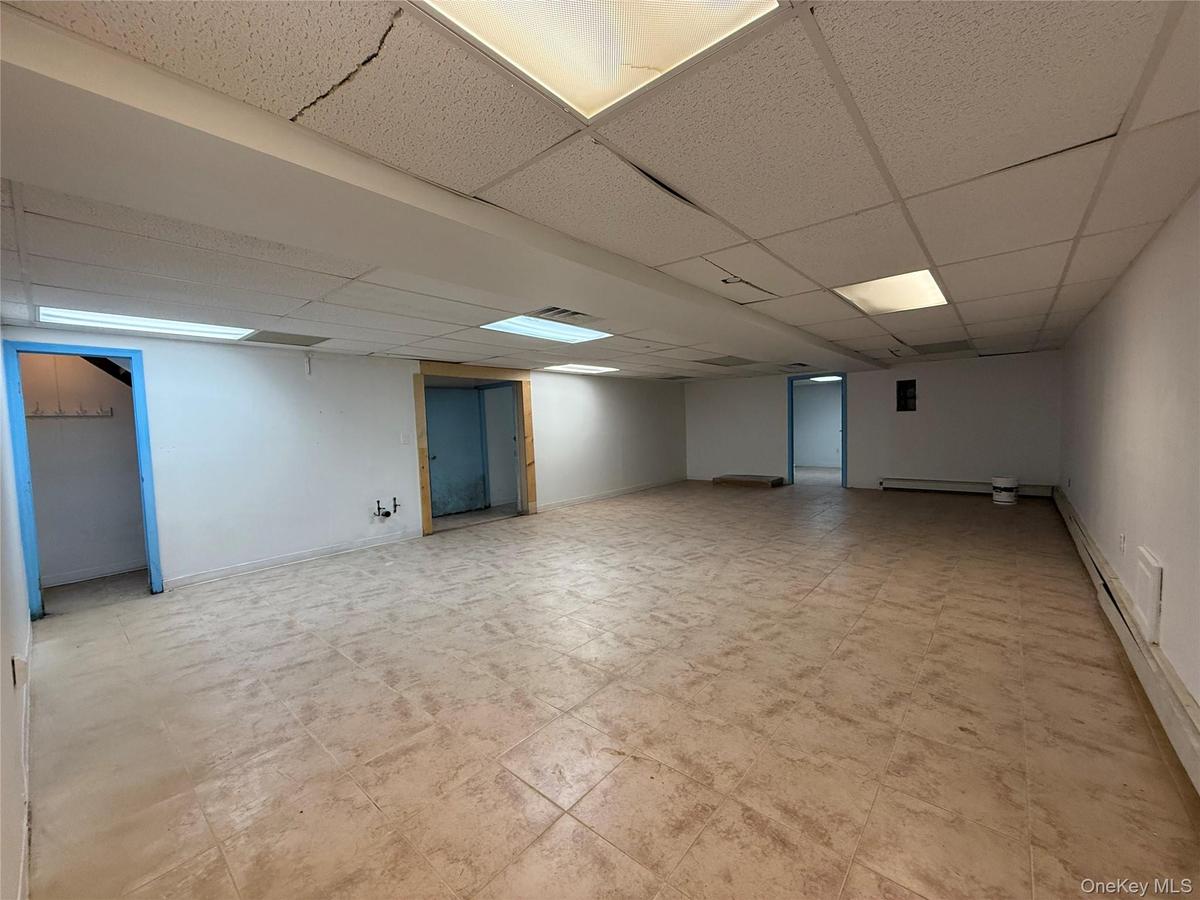 Basement featuring a drop ceiling