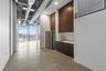 Hallway featuring concrete flooring and beverage cooler