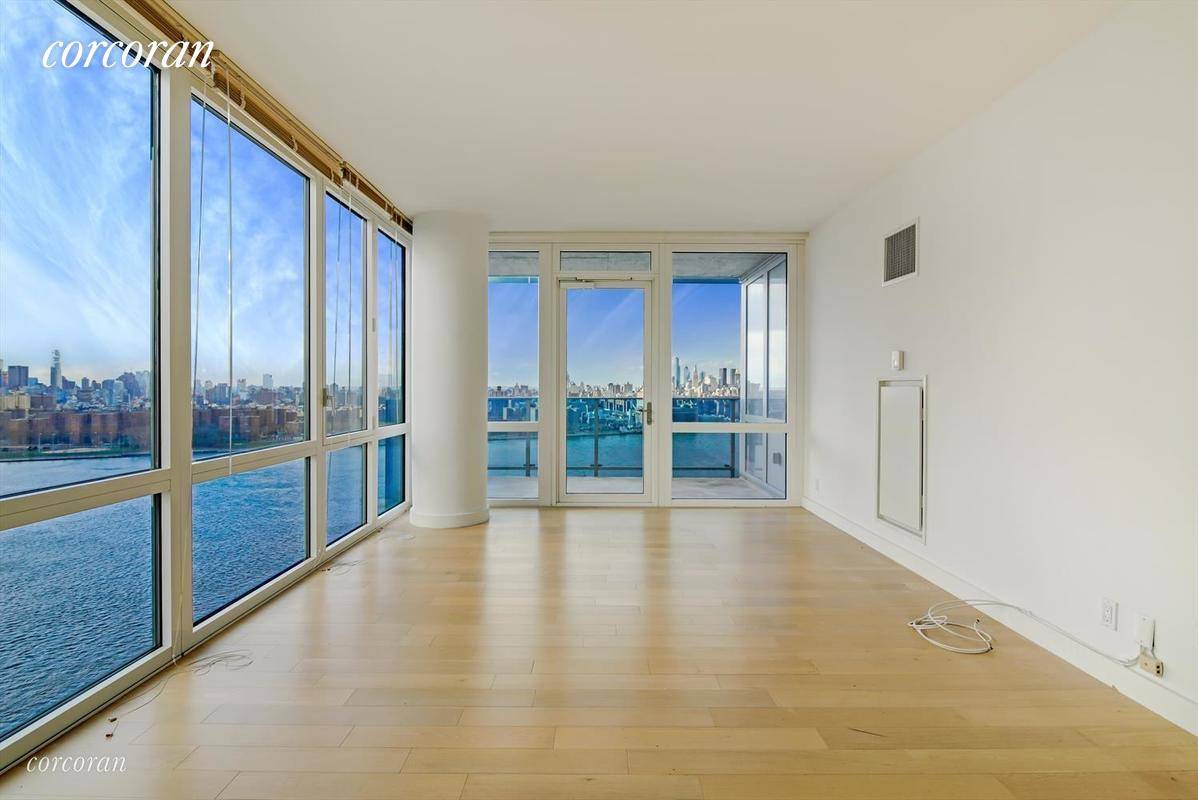 Enjoy stunning views of Midtown and Downtown Manhattan from this bright two bedroom two bathroom luxury condo rental with outdoor space at the Edge.