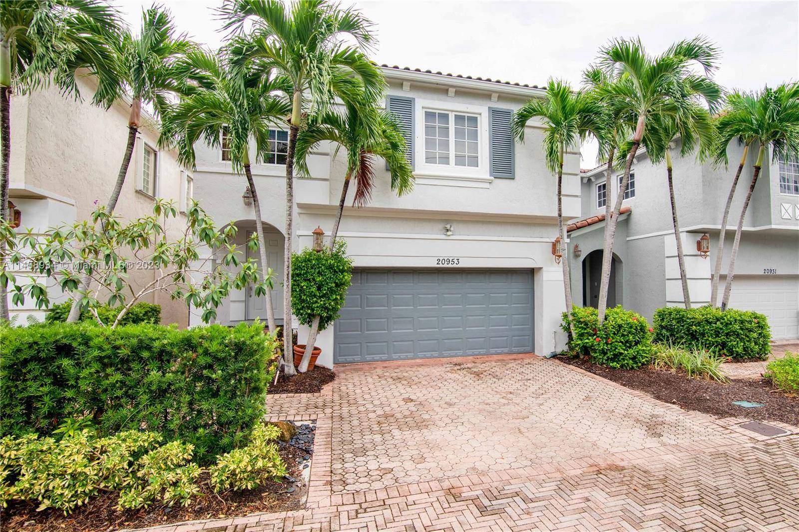 Welcome to this modern open concept home located in the prestigious Aventura Lakes Phase 1.