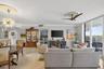 Marble flooring, water views, floor to ceiling glass, crown molding. Bright open and airy.