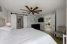 Barn doors leading to primary bathroom and closet