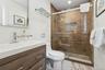 Bathroom with vanity and a stall shower