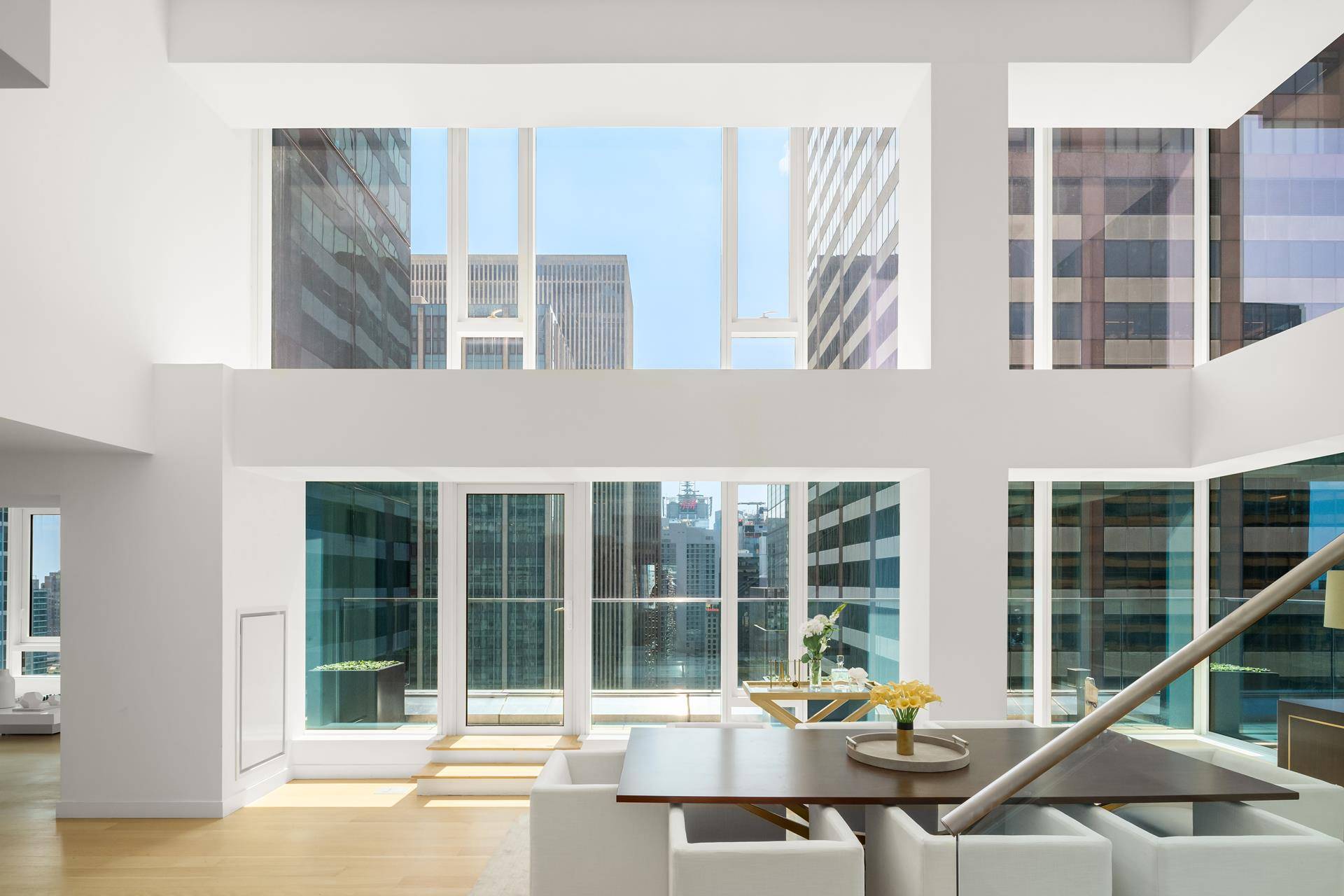 This extraordinary duplex penthouse soaring high above Midtown will take your breath away with its jaw dropping city views, meticulously designed interiors, and generous private outdoor space.
