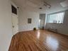Spare room featuring track lighting and wood finished floors