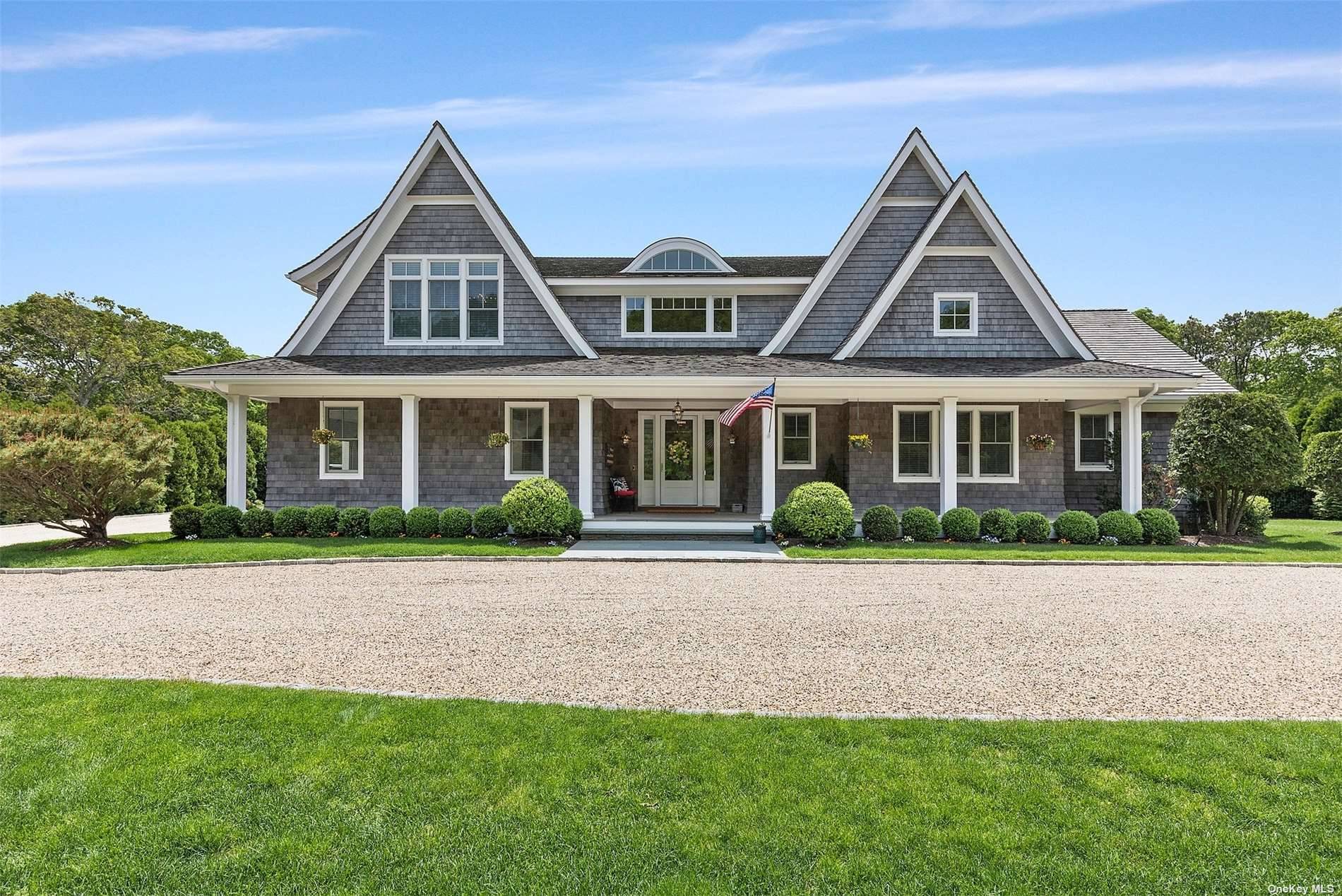 This newly constructed Quogue home, set on 1.