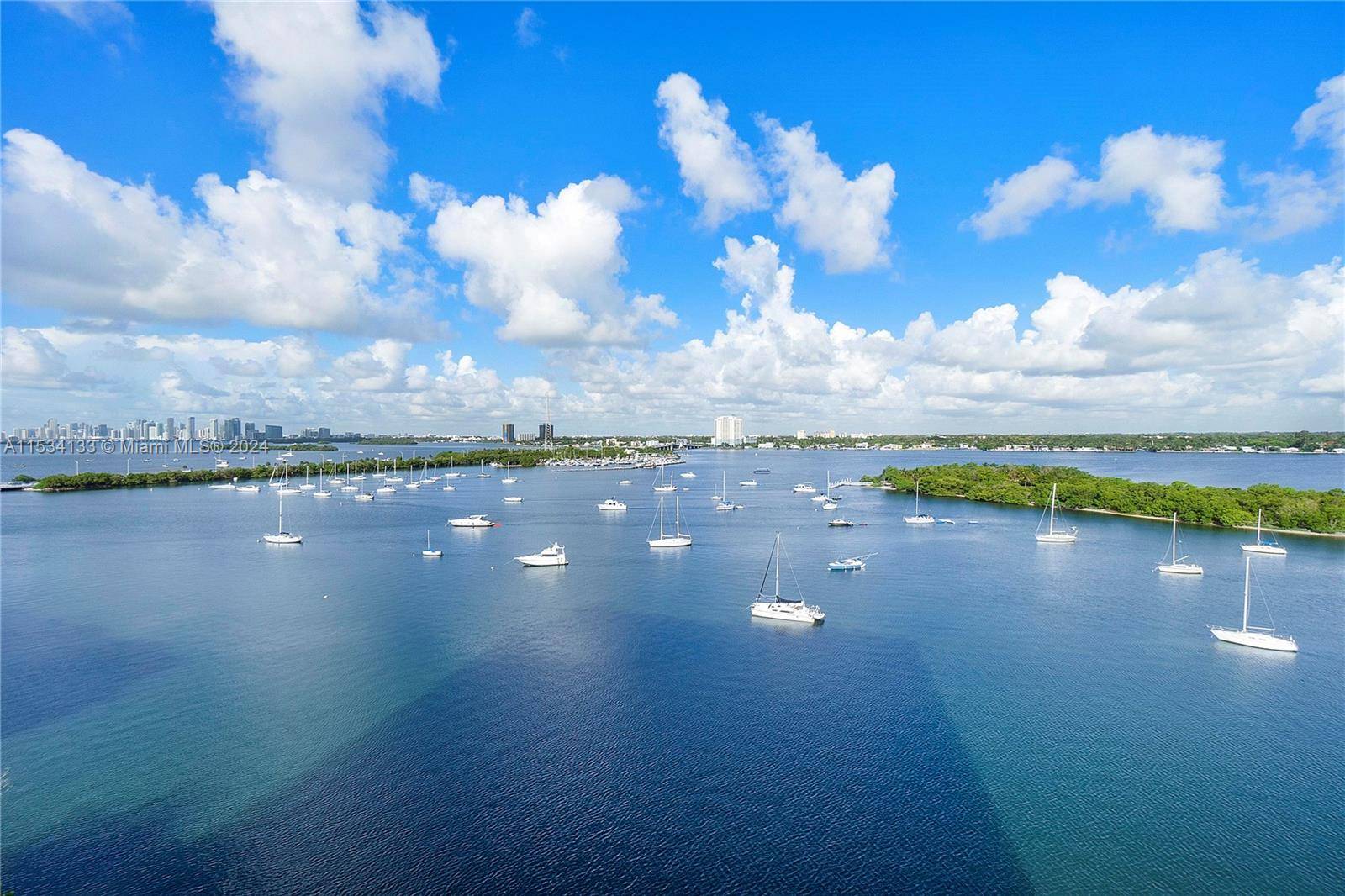 Unique fully furnished corner unit loft at the contemporary Space 01, a waterfront building, with panoramic views of Biscayne Bay and Downtown Miami Skyline in North Bay Village, designed by ...