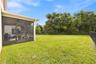 Back of the home with conservation area.