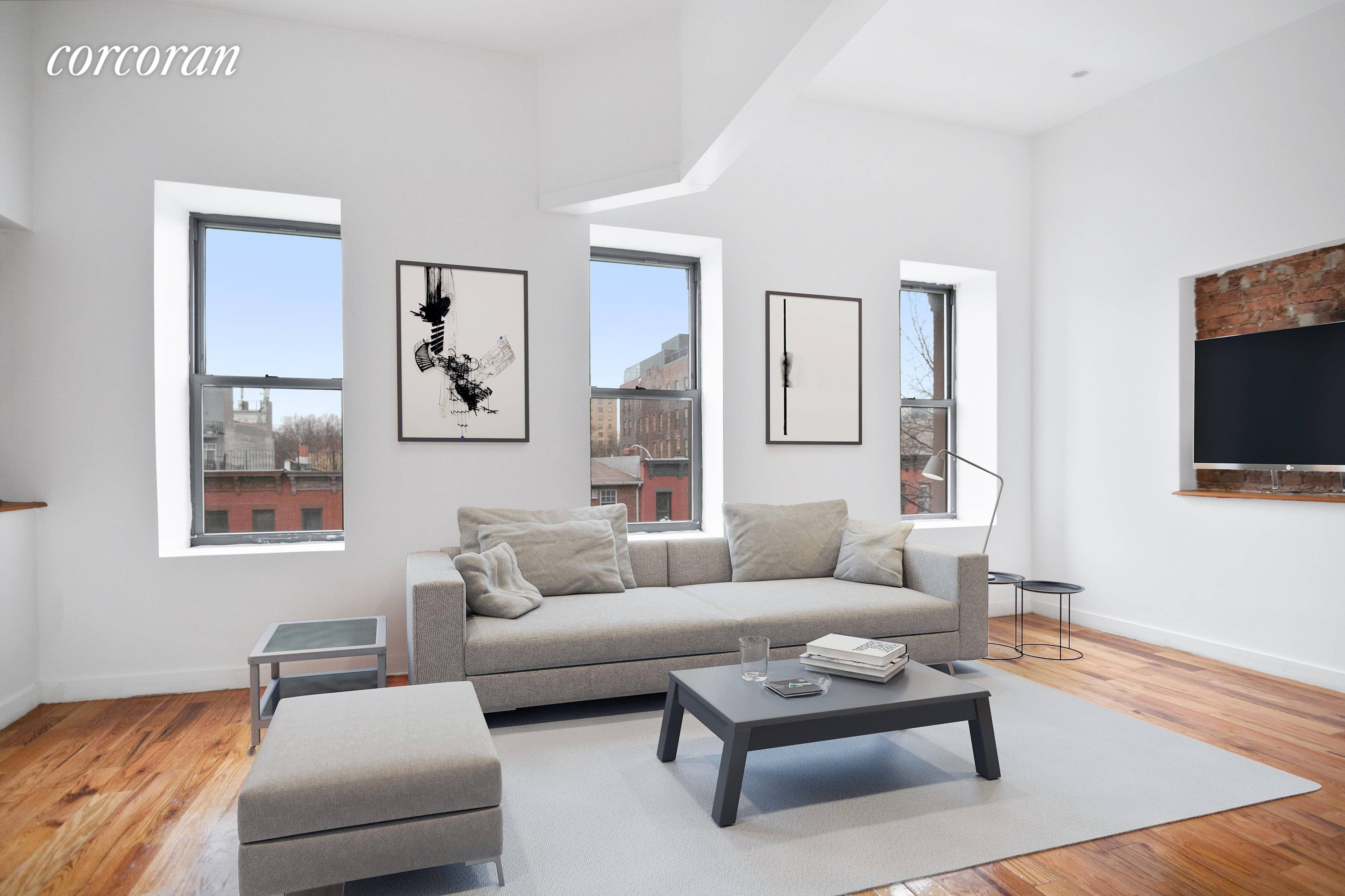 Let the light shine in ! This top floor, renovated two bedroom apartment features a modern kitchen that looks out to a spacious living area.