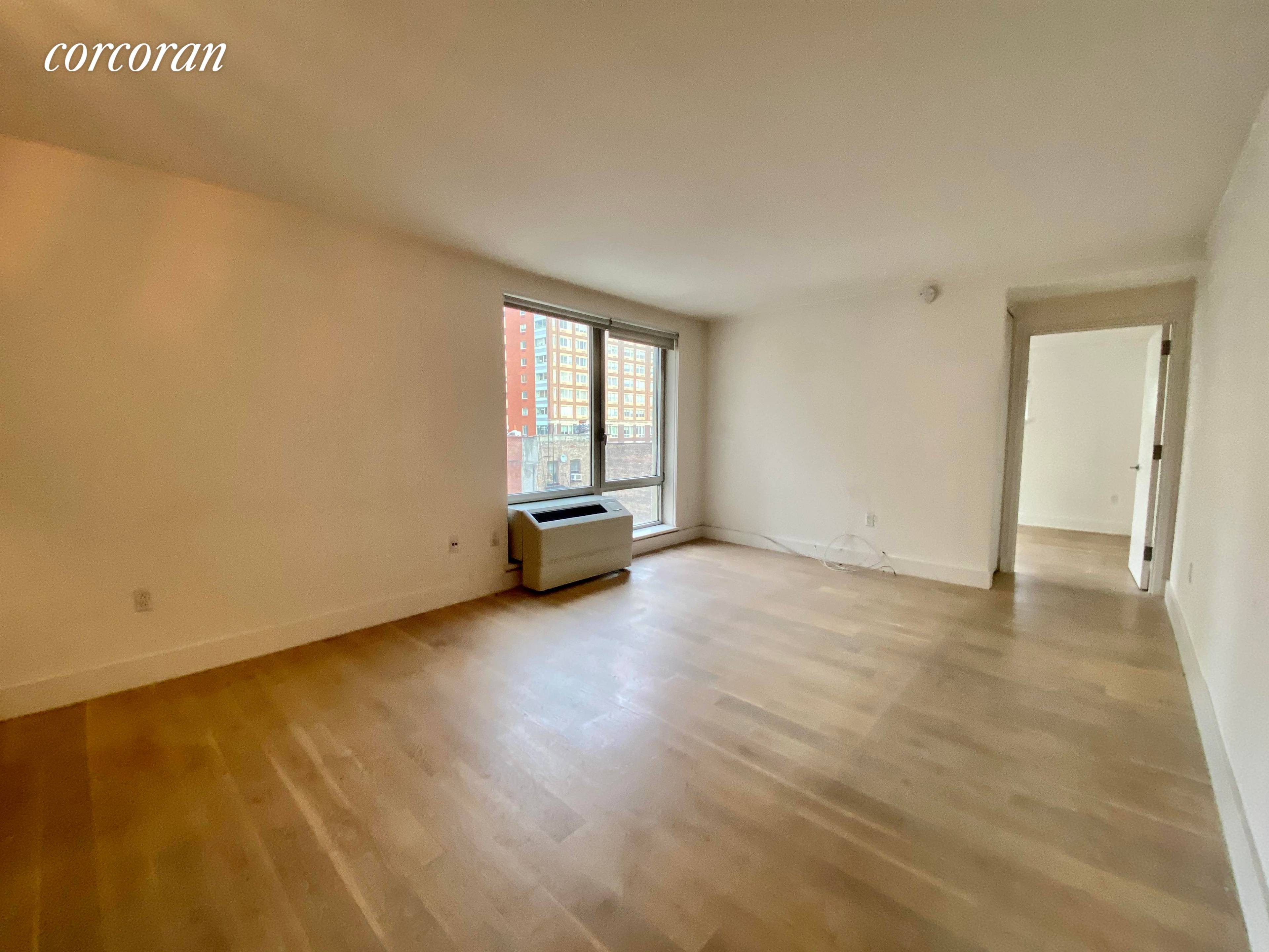 Gracious one bedroom layout featuring wide plank solid white oak floors, stainless steel appliances with paneled dishwasher, custom German kitchen cabinets with Caesarstone counter tops and Carrara marble backsplash, and ...