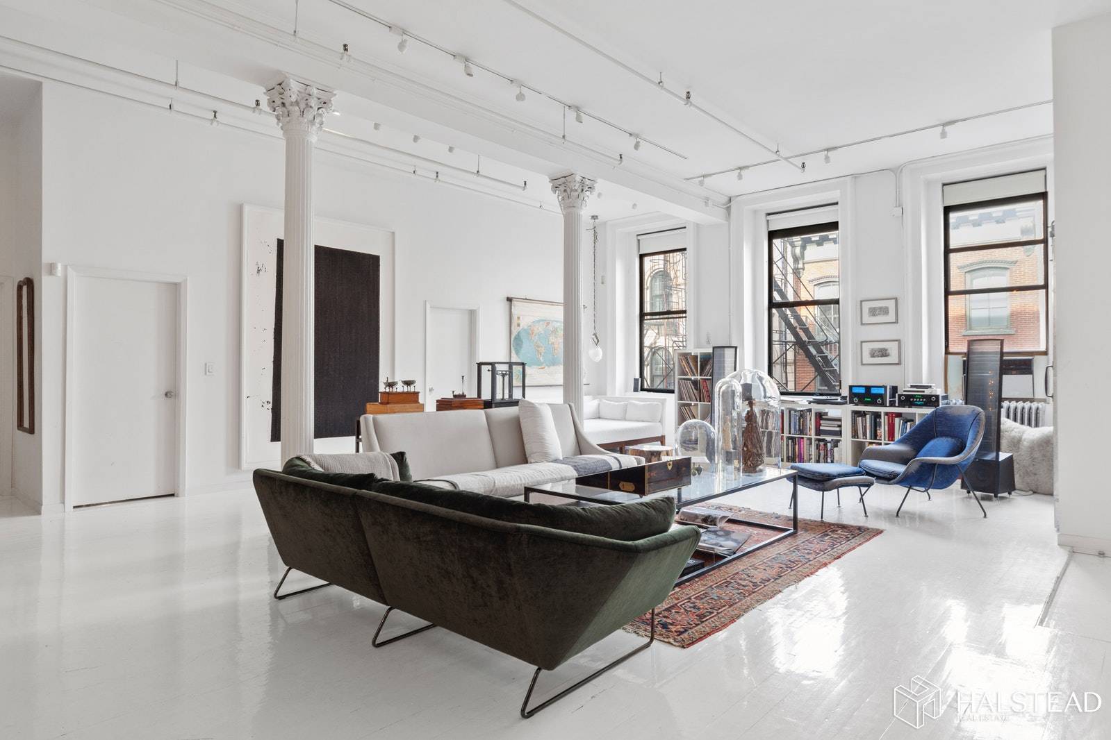 Step off the elevator into a wonderfully designed, dramatic square shaped loft, perfect for living entertaining, or shares, in a classic Tribeca cast iron loft building.