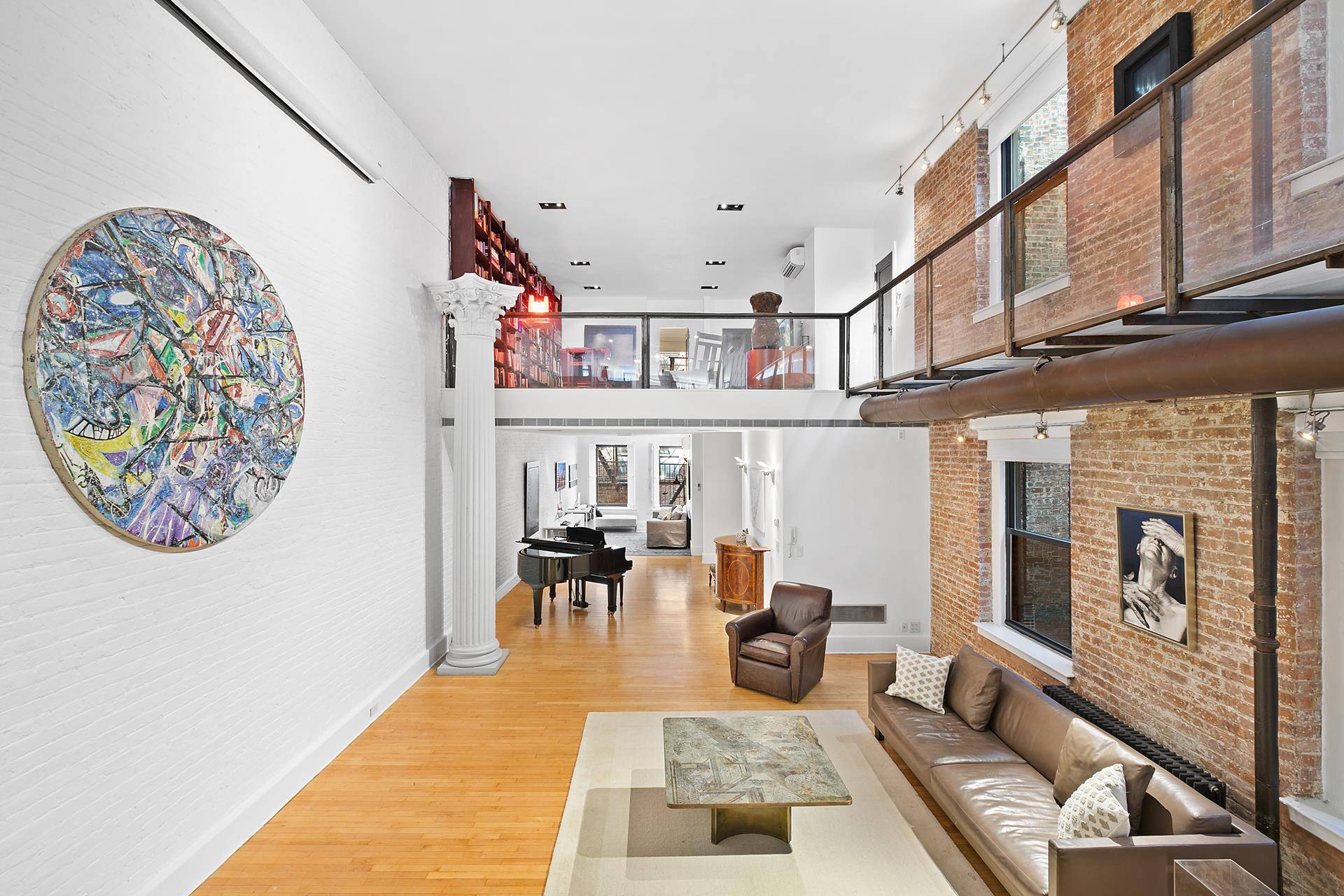 At more than four thousand square feet, dramatic double height ceilings greet you in this former choreographer's five bedroom duplex loft with central air conditioning and private laundry.