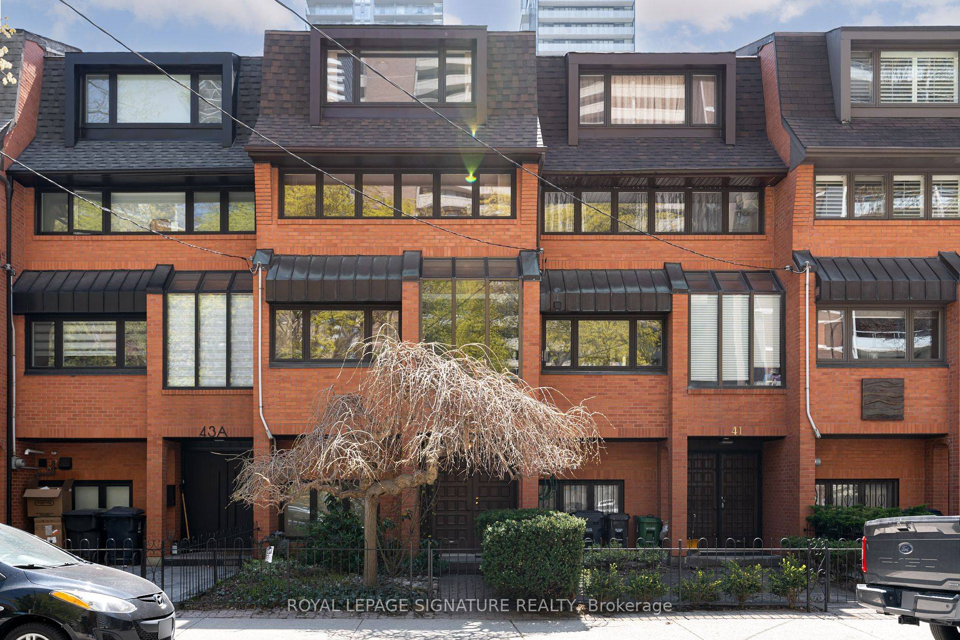 Introducing this expansive, sun drenched executive townhome, exuding a captivating blend of seventies allure and contemporary luxury, ideally situated steps from Yonge and Bloor.